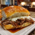 Close-up of homemade Crockpot French Dip Sandwich on white plate